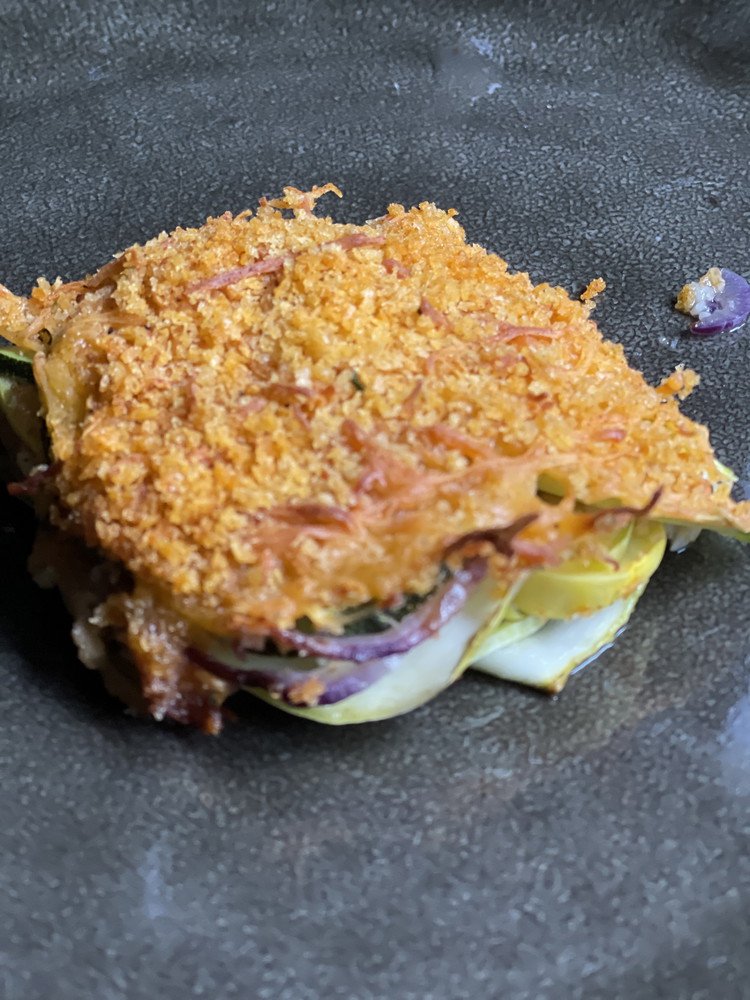 Image of Bake for 40-45 minutes until vegetables are tender crisp. Let rest for 5 minutes before slicing into 4 equal sized pieces and serving.