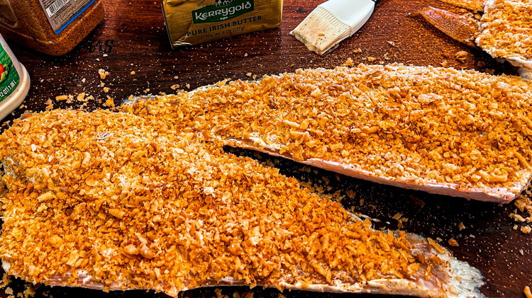 Image of Spread broken up fried onion on top of red fish. The ranch dressing will work as a binder.