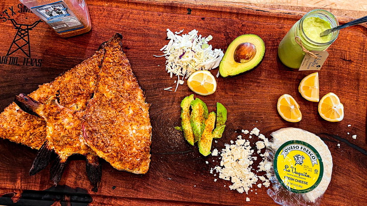 Image of Once the fish is ready, heat up some corn tortillas and add fish. 