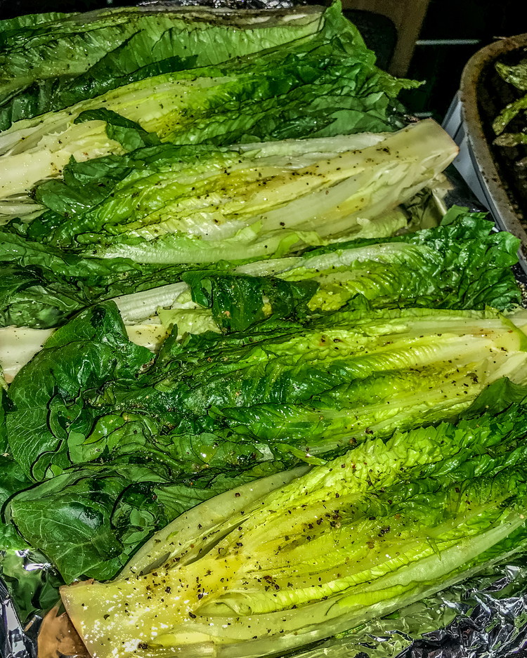 Image of Wash head of lettuce and dry thoroughly. Split lengthwise and remove outer leaves. Brush with oil then season with garlic and Bold & Beefy Seasoning.