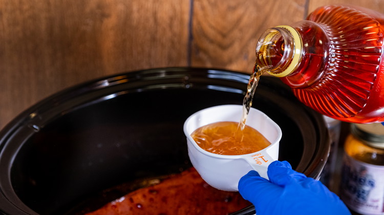 Image of Pour the apple juice around the pork loin. Be careful as to not wash the raspberry chipotle off your pork. 