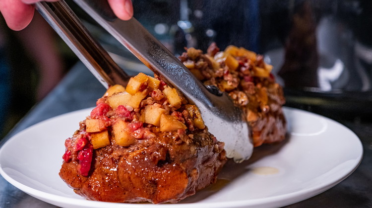 Image of After the pork loin is finished cooking, remove, slice and serve. Remember to garnish with fresh raspberries and a sprinkle of chopped pecan!
