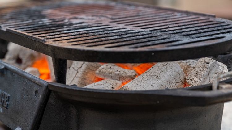 Image of Preheat the grill. We used Blues Hog Premium Hog Logs in a cast iron tabletop grill for this. 