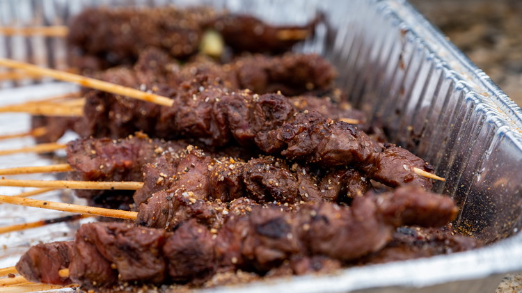 Image of The meat will cook very fast over the high heat. Once you have a nice sear on both sides, quickly remove to a serving dish to the side and season.