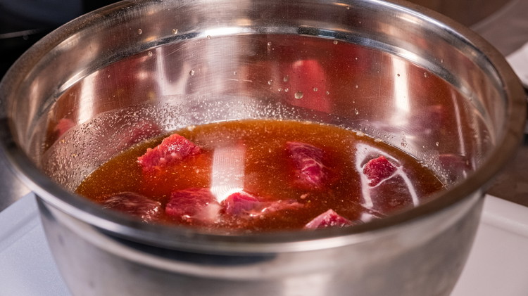 Image of In a bowl, stir together the dry Beef Marinade with water. Place beef in and let marinate for 30 mins to 1 hour (or overnight in the refrigerator for stronger flavor).