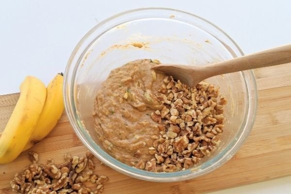 Image of Add the banana bread mix and chopped walnuts to the...