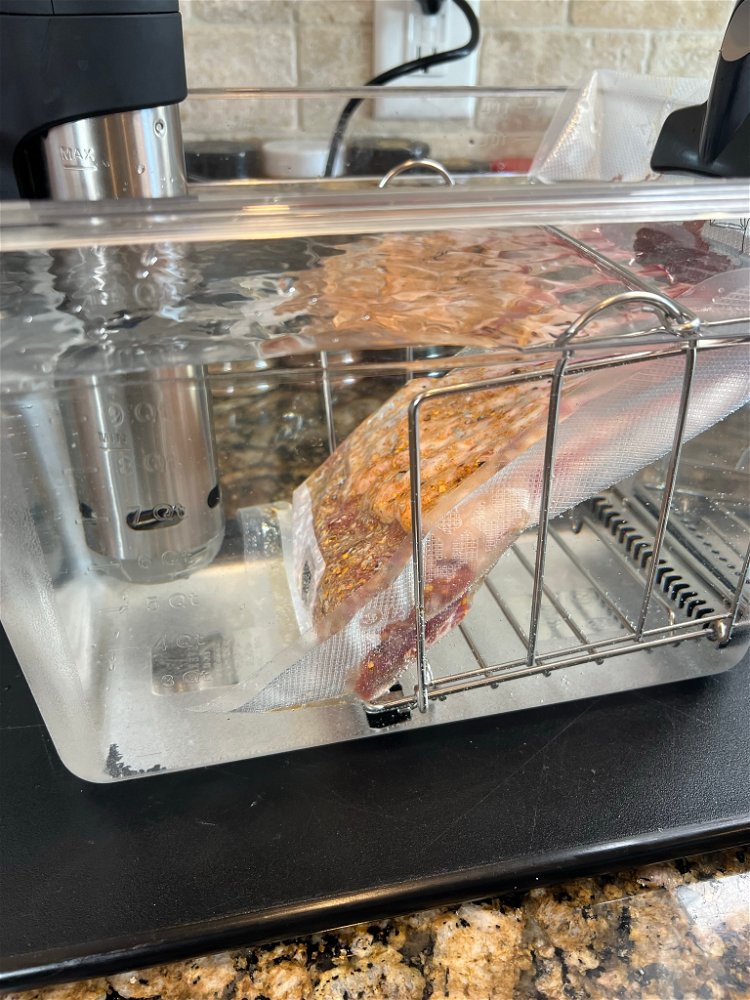 Image of Place your Bagged lamb rack into the water and let...