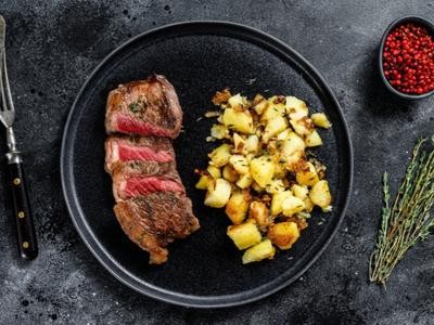 Image of Grilled Organic Steaks with Rosemary Potato Wedges