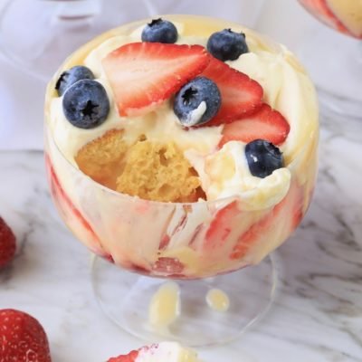 Image of Top with whipped cream and decorate with berries as desired.