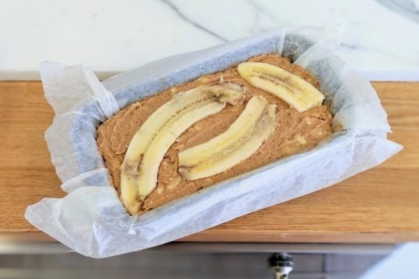 Image of Spread out the mixture and decorate with extra banana (optional)