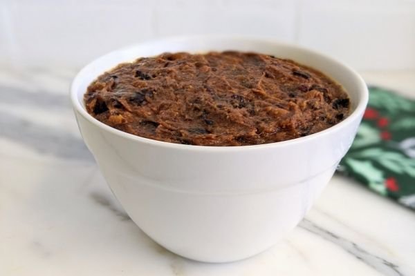 Image of Pour in pudding mix and even out. Place a lid...