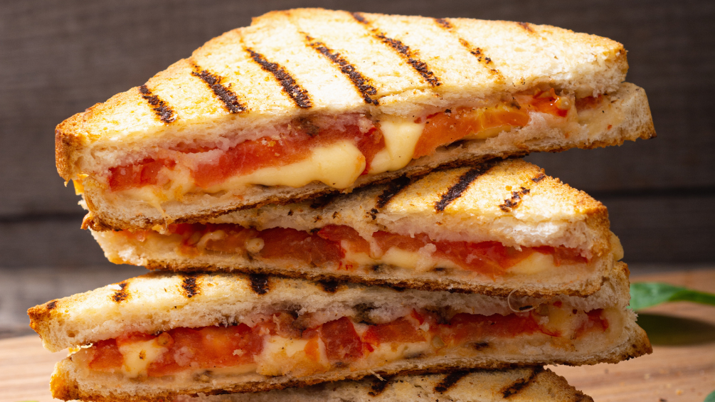 Image of Sourdough Grilled Cheese Recipe with Swiss, Cheddar, Bacon, and Tomato