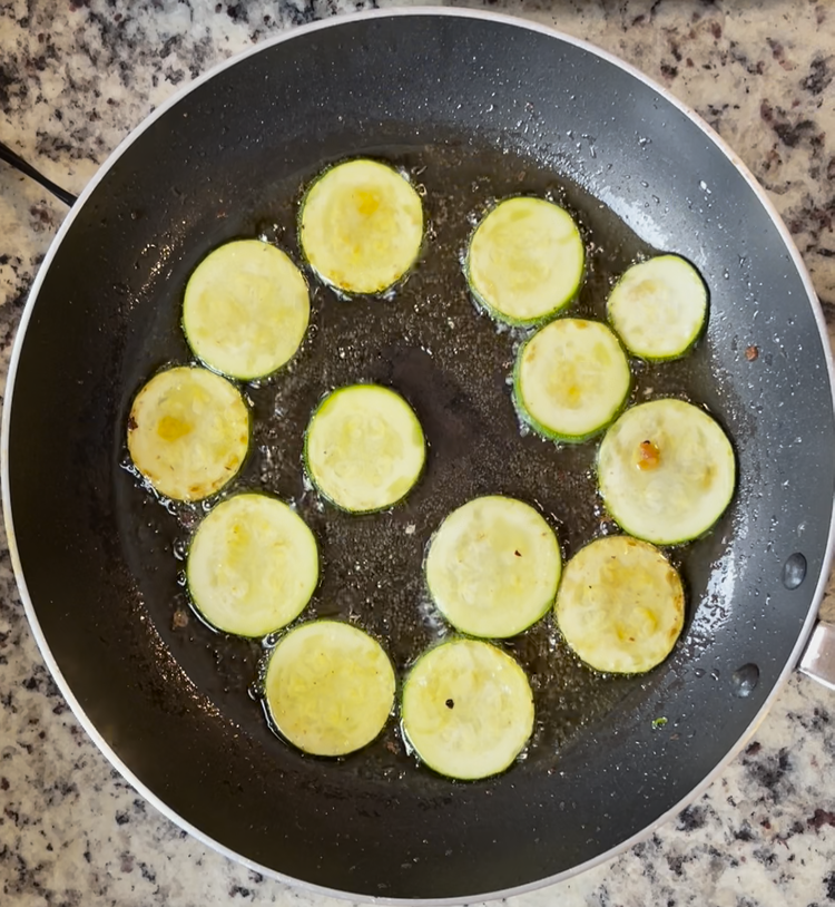 Image of Remove the onions and add the zucchini, cooking until the zucchini has developed color and is tender, approximately 5 minutes. Set aside to cool