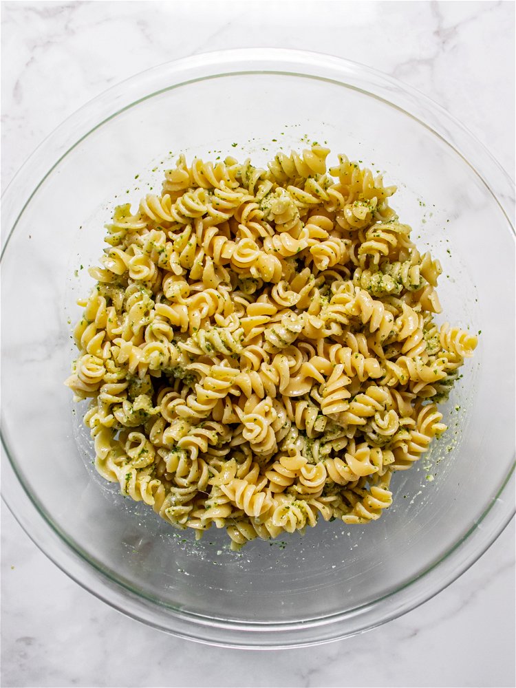 Image of Strain pasta and transfer to a large clean bowl. Allow...