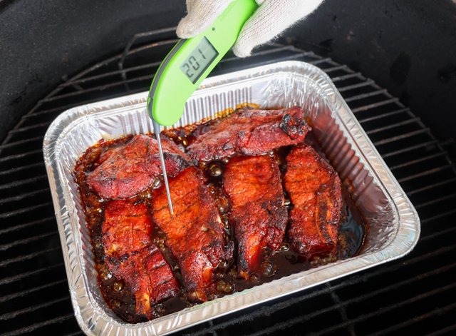 Image of Place the seasoned ribs on the cooking grate and smoke...