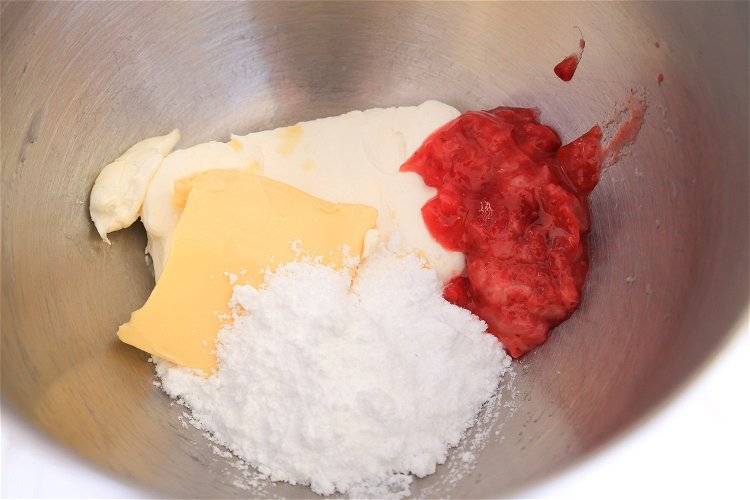 Image of Place cream cheese, butter, icing mix and mashed strawberries in a mixing...