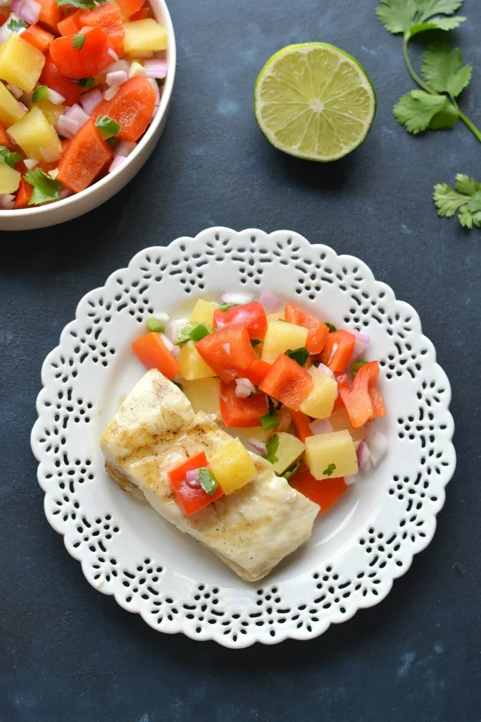 Image of Remove halibut from the grill and serve immediately with the...