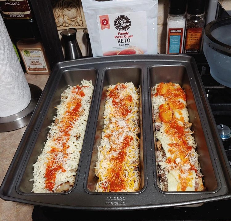Image of Top the dough with a no-sugar added marinara sauce and...