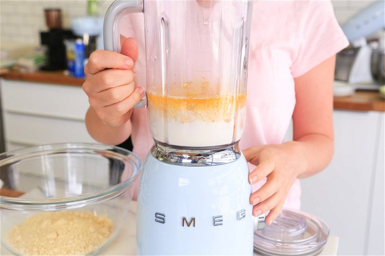 Image of Place the 2 halved lemons into a blender/food processor with...