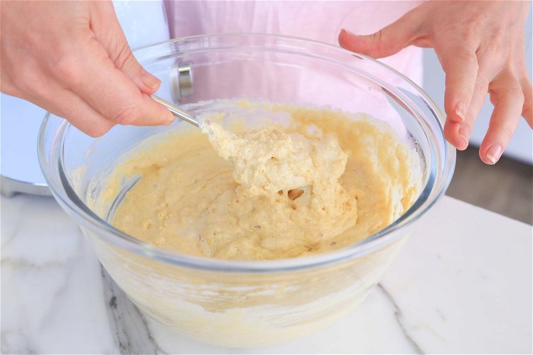 Image of Place the vanilla cupcake mix into a bowl and pour the lemon...