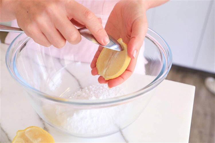 Image of Cut the remaining lemon in half and spoon out the...