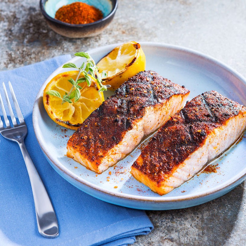 Premium Photo  Fish, trout, chum salmon, humpback, a piece baked, grilled,  with a slice of lemon and lettuce