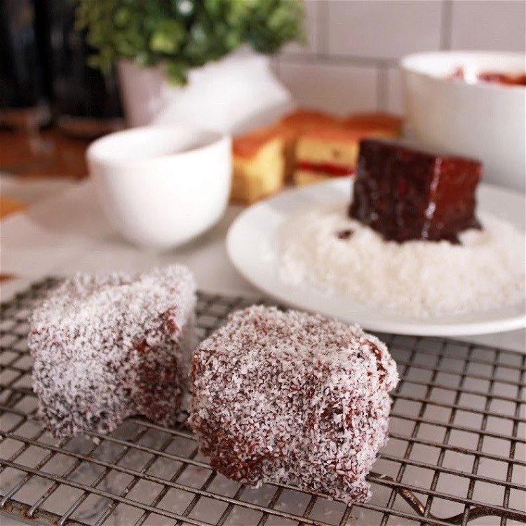 Image of Roll the coated cake in the coconut and coat all...