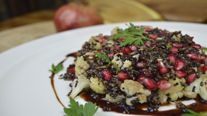 Image of Baked cauliflower salad with goat cheese, quinoa and pomegranate