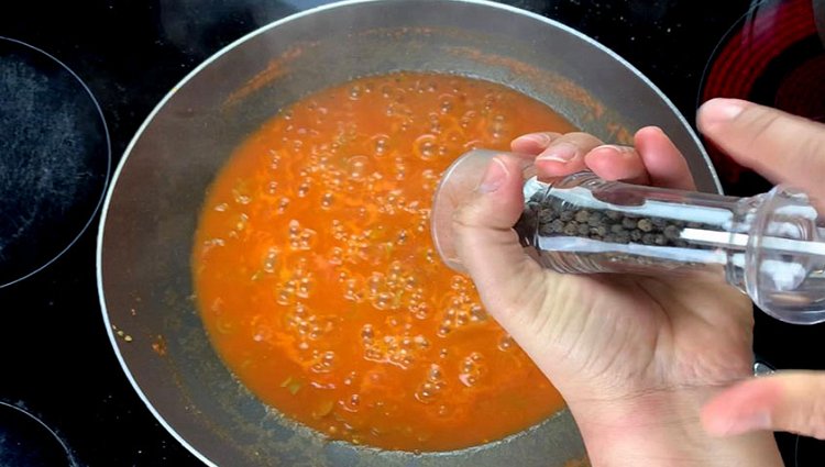 Image of Add the tomato and lower the heat. Let the tomatoes...