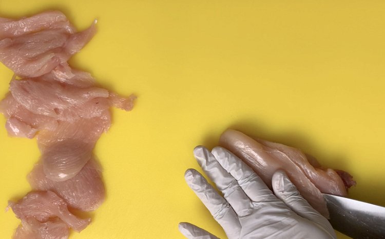 Image of Cut the chicken breasts into very thin slices.