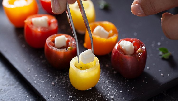 Image of Place a square of goat cheese inside each tomato.