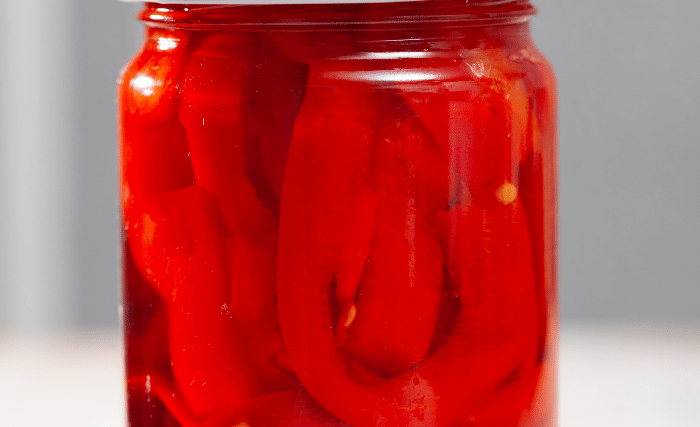 Image of Grab your hot jars and fill them with the peppers...