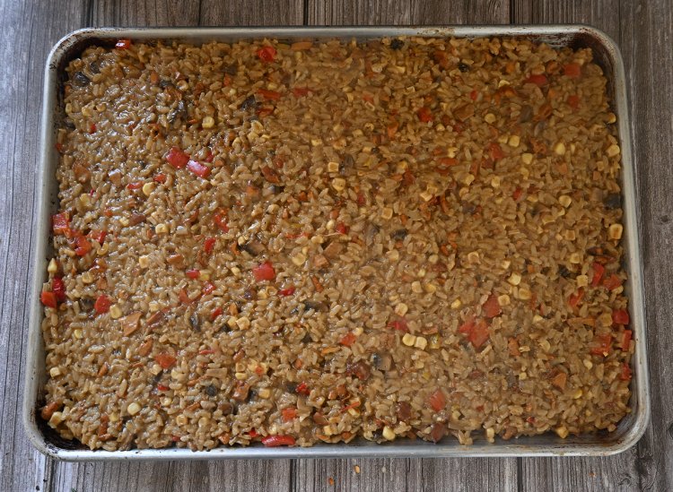 Image of Line a large sheet pan with parchment paper and evenly...