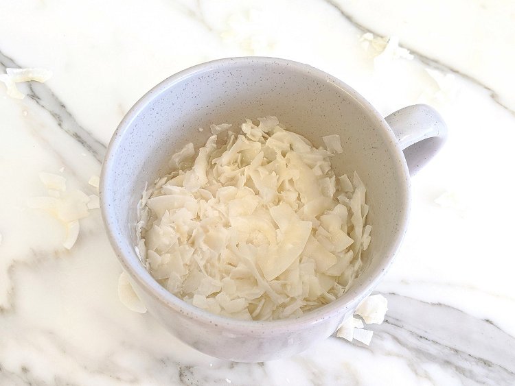 Image of Soak Coconut: Place the coconut flakes in a heatproof bowl...