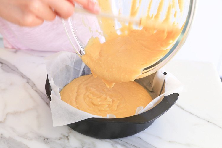 Image of Pour the butter cake mix into the lined baking tin...