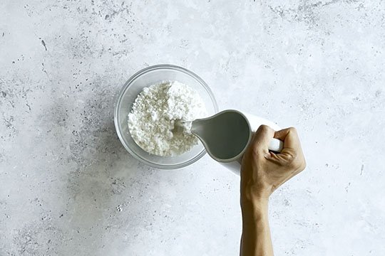 Image of In a medium mixing bowl, add the coconut milk powder...
