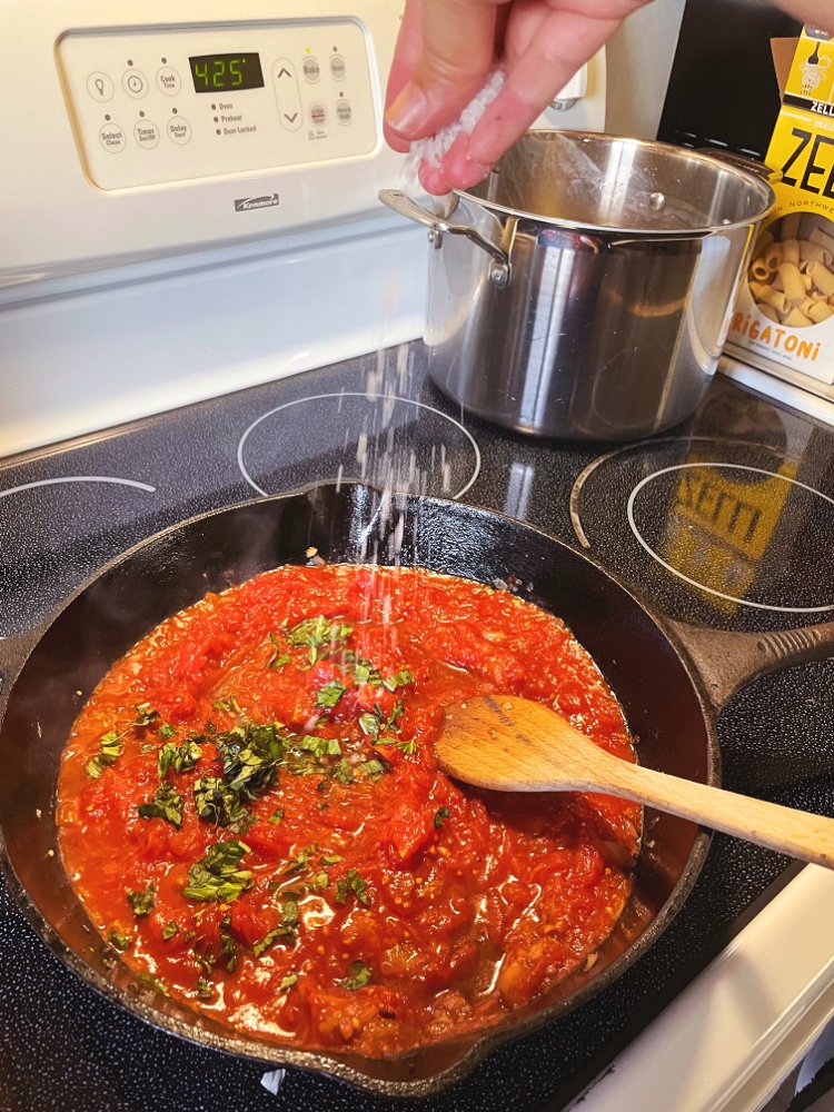 Image of Add tomatoes, chopped Basil, salt, and crushed red pepper. Bring...