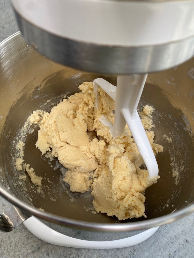 Image of Slowly add the flour, baking powder and salt and mix...