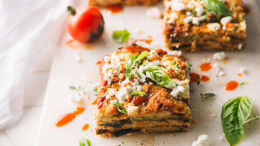 Lasagna with Cashew Cheese, Garnished with Goat Cheese and Fresh Basil