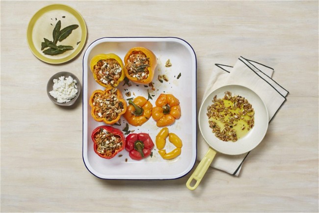 Image of Banza Rice Stuffed Peppers with Feta, Pepitas, and Chili-Sage Oil