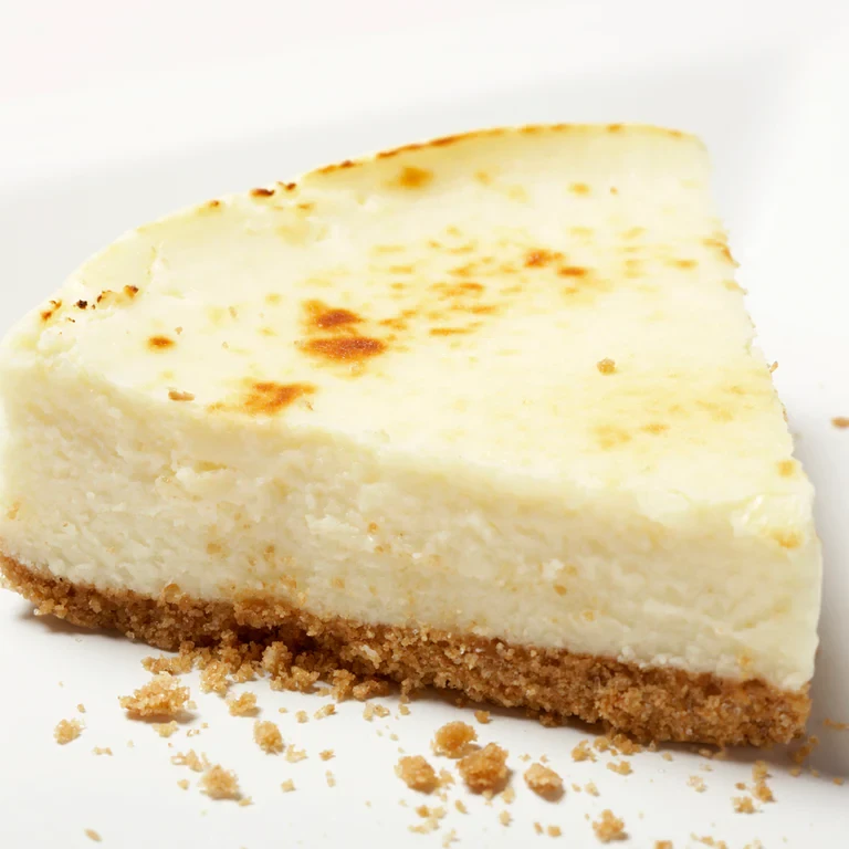 https://images.getrecipekit.com/20220929203457-nutmeg-cheesecake_1024x.webp?aspect_ratio=1:1&quality=90&