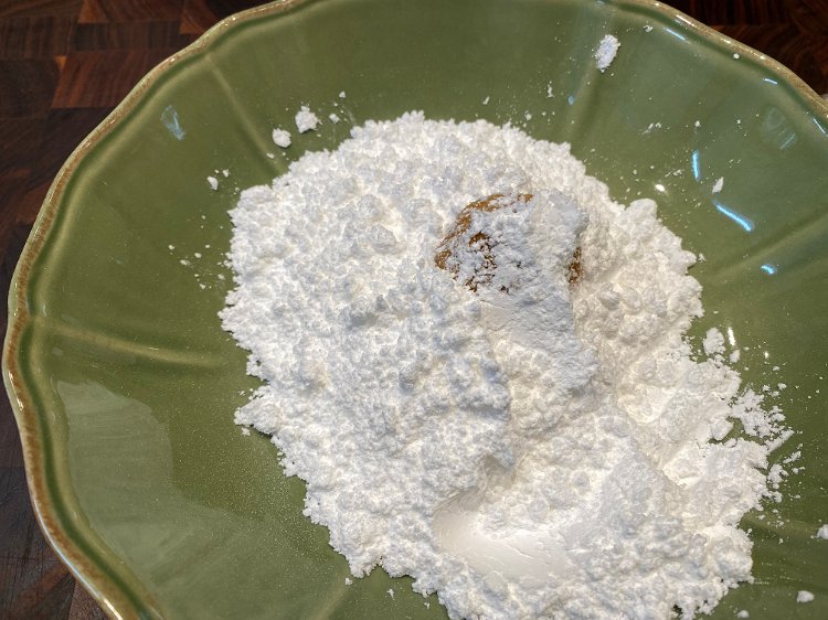 Image of Add the balls to into the powdered sugar and coat...