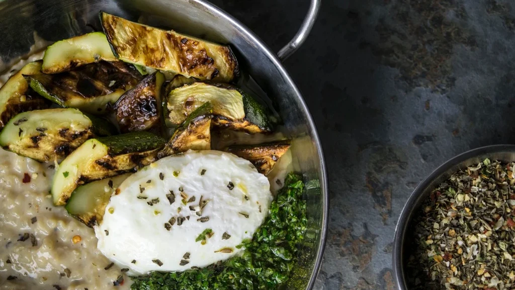 Image of Savory Arroz con Leche with Grilled Squash, Poached Egg, and Chimichurri