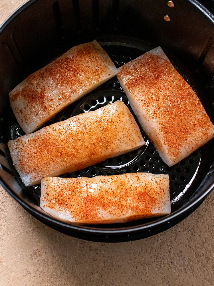 Image of Coat each portion of halibut with seasoning and place in...