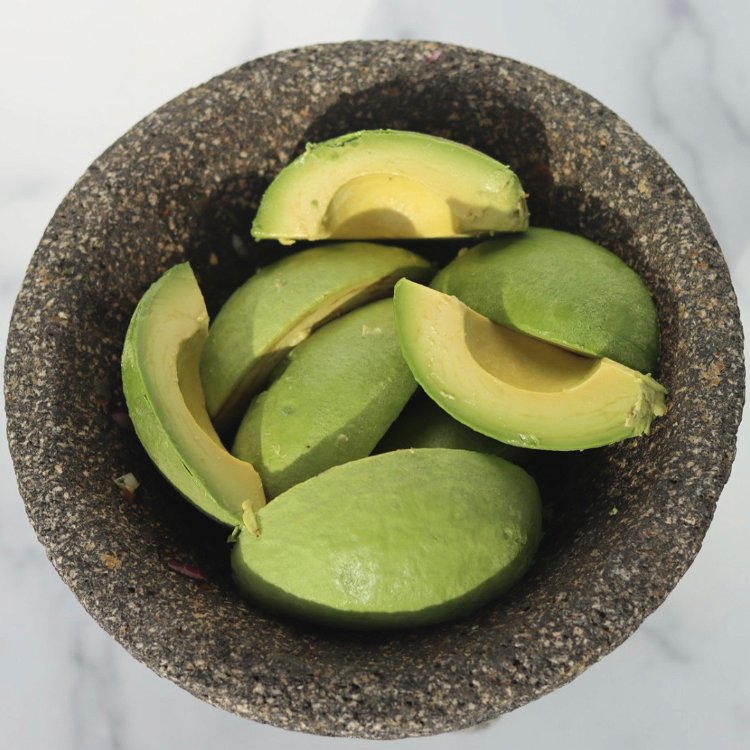 Image of Cut, pit and remove avocado skin. Mash the avocado with...