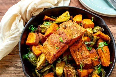 Image of Serve the seared salmon fillets over the roasted vegetables.