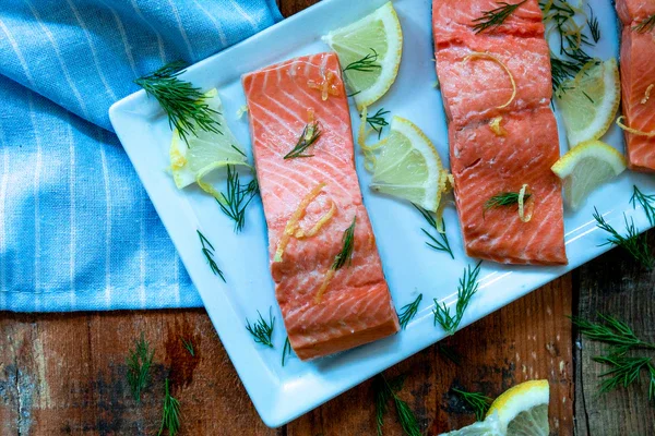 Image of Add salmon fillets to the pan. Bring the liquid to...