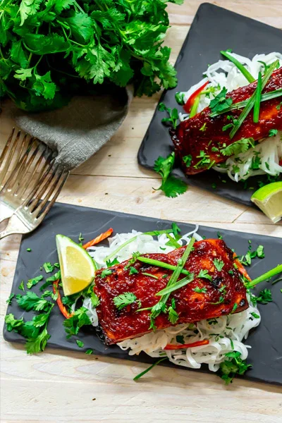 Image of Serve the Asian BBQ Salmon Fillets garnished with fresh scallions...