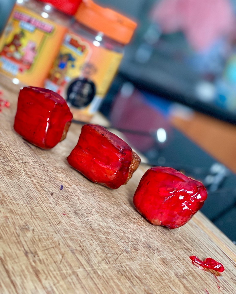 Image of Have a tray lined with baking paper ready to rock and roll. With your bacon burnt ends on kebab skewers, dip into the toffee solution then place bacon side down onto the tray. (only dip part way as you don’t...
