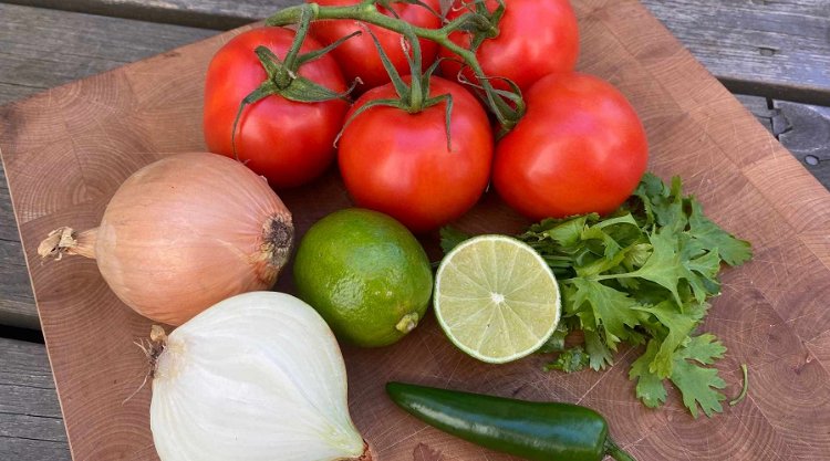 Image of Wash your ingredients (tomato, onion, cilantro, and jalapeno). Dice the...